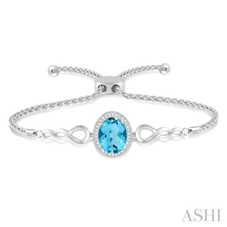 10x8 MM Oval Shape Blue Topaz and 1/20 Ctw Round shape Diamond Sterling Silver Lariat Bracelet